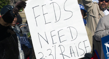 NTEU rally sign stating "FEDS NEED 3.3% RAISE"